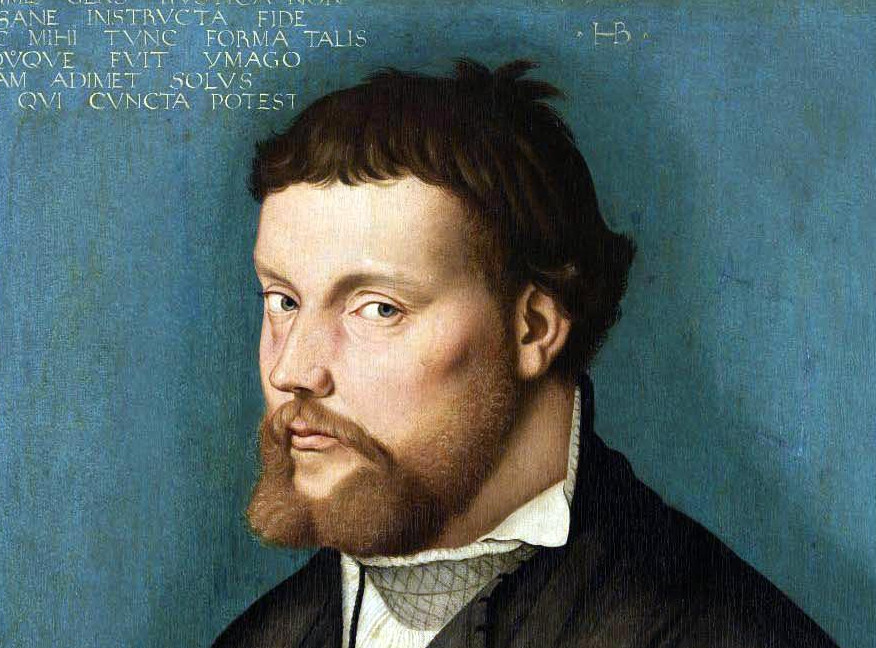 Das Gemälde von Hans Baldung Grien, entstanden 1526, zeigt einen Mann als Brustbild in Dreiviertelansicht vor einem grünblauen Hintergrund. Er hat blaue Augen sowie rötlich-braunes Haar und einen Bart. Sein Blick geht seitlich zum Betrachter. Die linke Hand ist erhoben, als würde er sprechen. Er trägt ein schwarzes Gewand mit auffällig gemusterten Seidenärmeln und einen bestickten Hemdkragen.